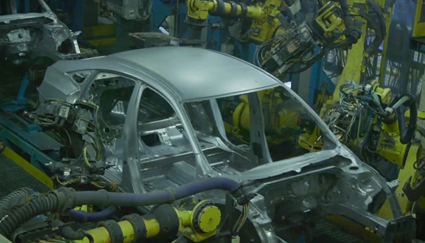 The frame of a vehicle is shown on the line. 